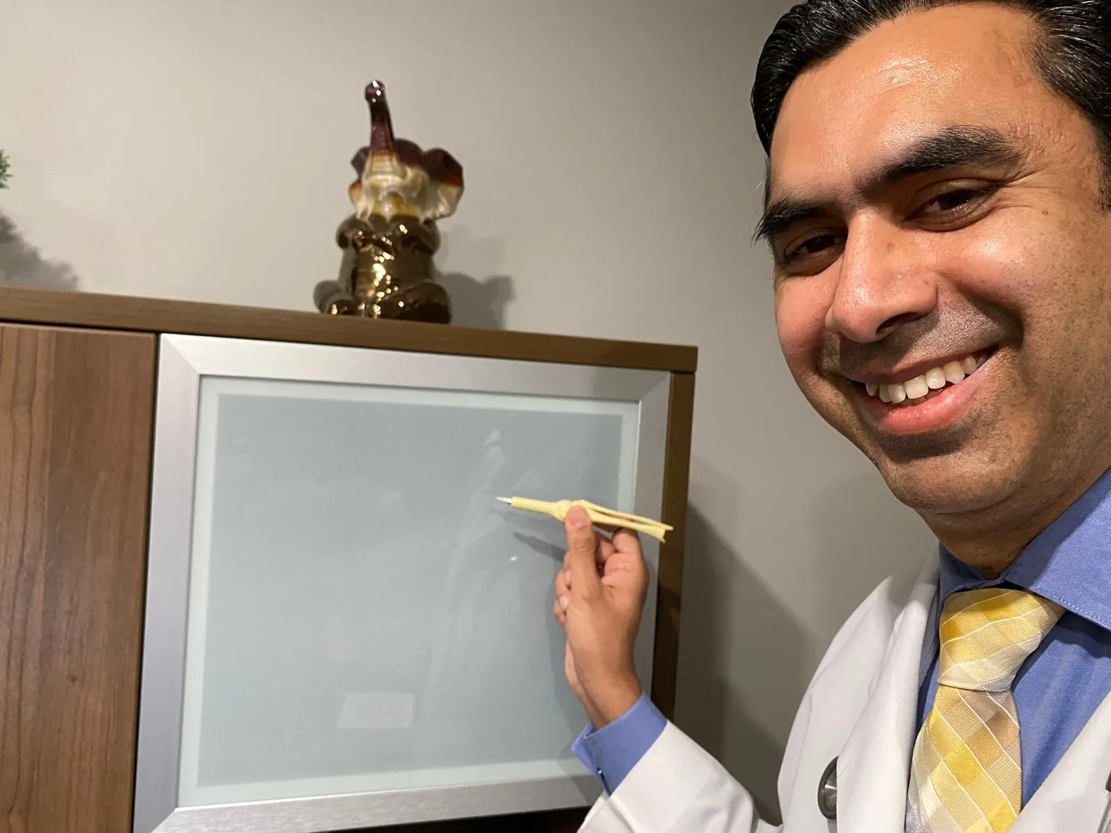 Dr. Ritesh Kohli explaining a treatment plan